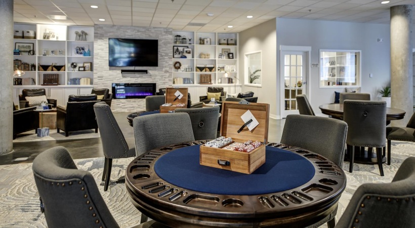 a game room with card playing tables
