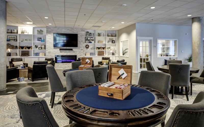 a game room with card playing tables