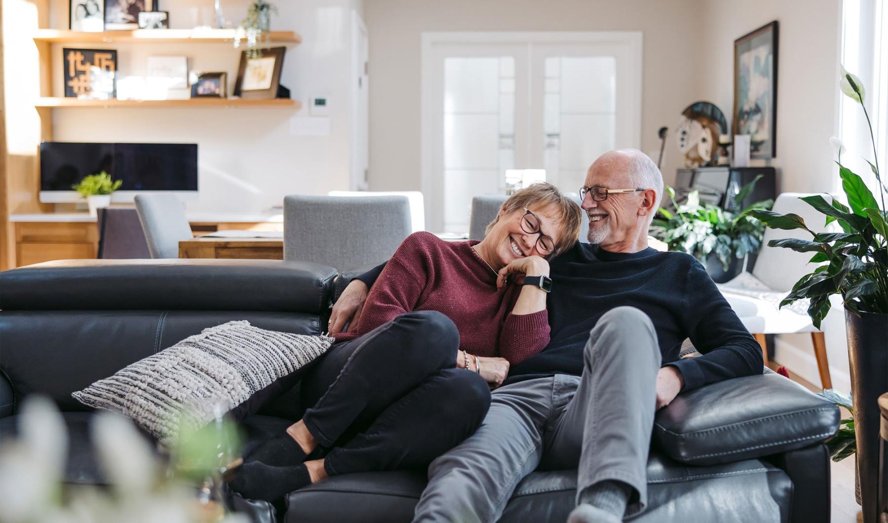 a man and woman sitting on a couch